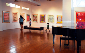 A family visits the gallery at the Watts Towers Arts Center,