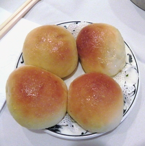 plate of baked buns filled with barbque pork