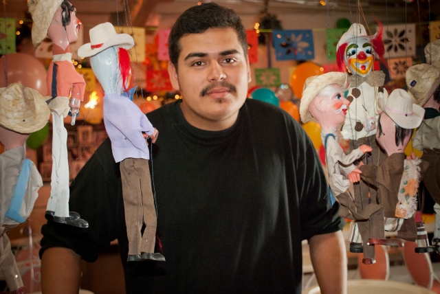 a puppeteer with display of puppets
