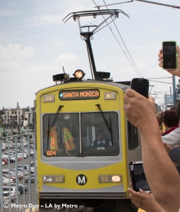 Cell phone paparazzi greet the first Expo Line train between LA and Santa Monica.